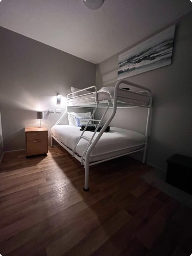 Private triple room at The Nest Strandhill with a double lower bunk and single upper bunk